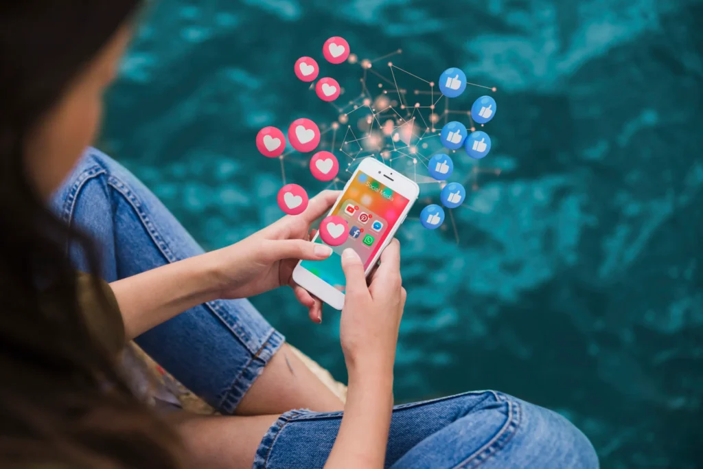 Woman using a smartphone with floating social media icons, representing digital engagement and online interactions